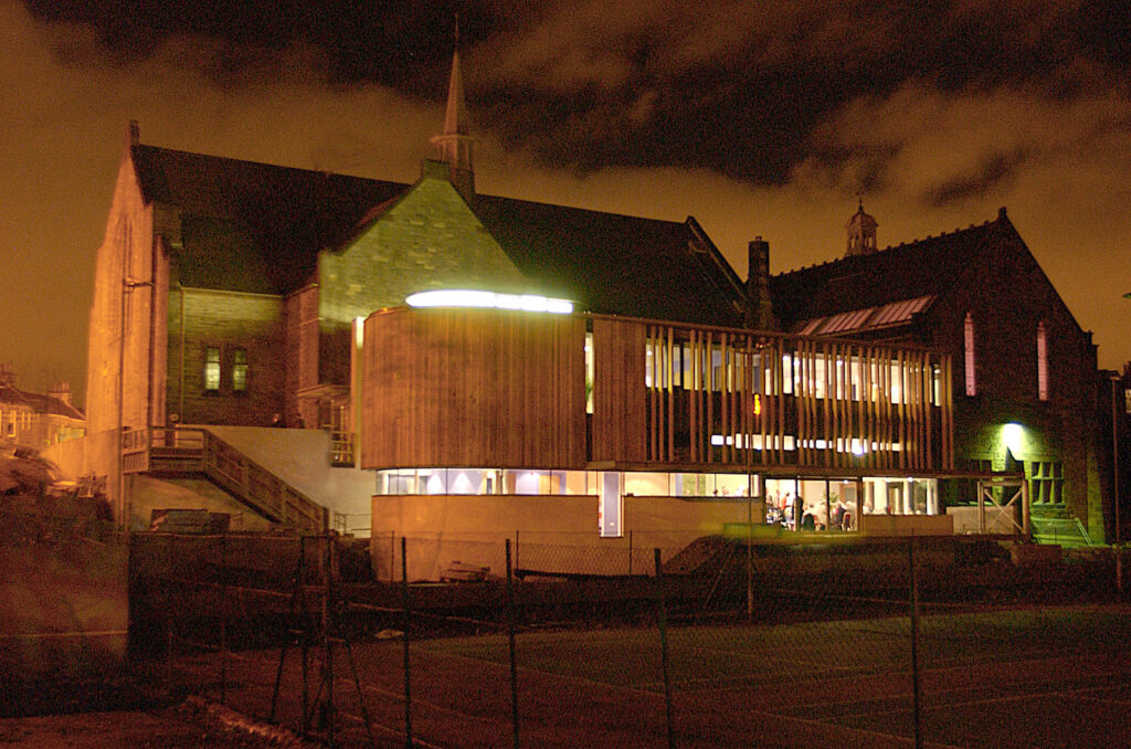 Greenbank extrior at night with internal lights