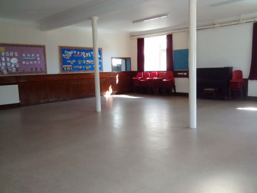 Lower Hall: looking towards south-east corner. Note the serving hatch, and piano below the white screen