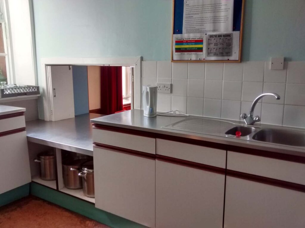 Kitchen, showing serving hatch into Lower Hall