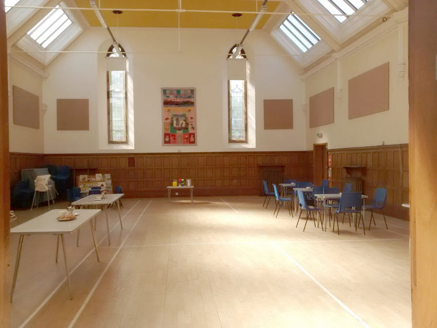 Main Hall: Looking south. There is a piano in the left hand corner.